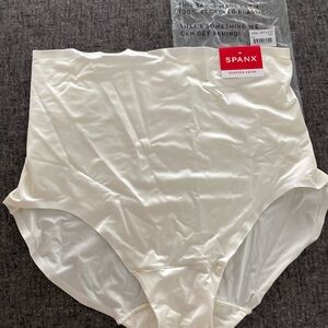 New with tags Spanx shaping satin brief in linen, size large.